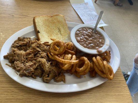 Pulled pork with curly fries, pinto beans and Texas toast