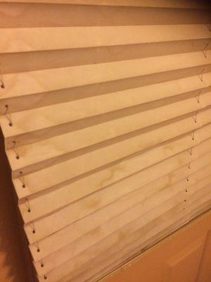 Water stained window blinds.