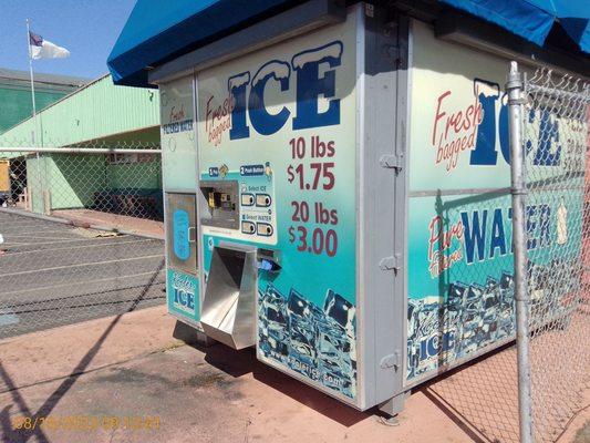 Ice machine, line for food bank starts outside of it.