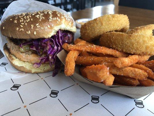 Hawaiian Salmon Sandwich with half sweet potato fries & half onion rings.