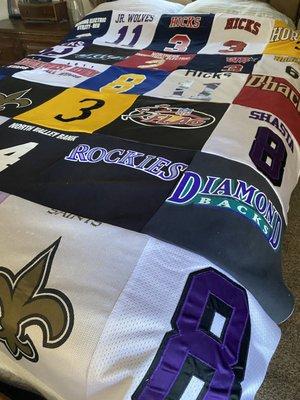 Custom made quilt made out from son's athletic jerseys