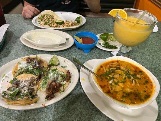 Lengua and chicken tacos, menudos soup, and mango/pineapple margarita