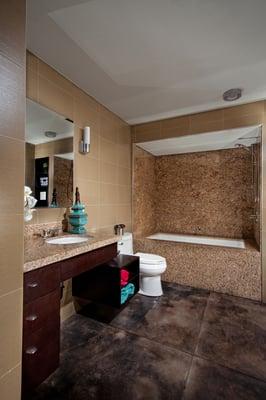 Bathrooms with Custom Designed Fixtures, Granite Counters and Tiled Showers