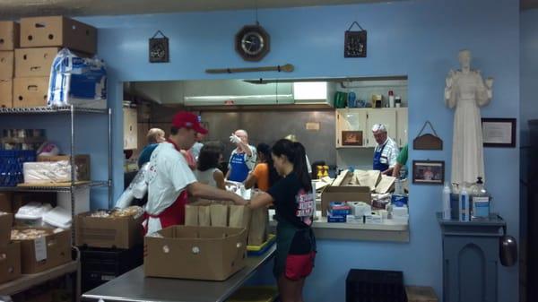 Volunteers hard at work cooking gallons of soup and making hundreds of sandwiches