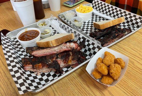 A three rib tray and two rib tray with a side of corn nuggets