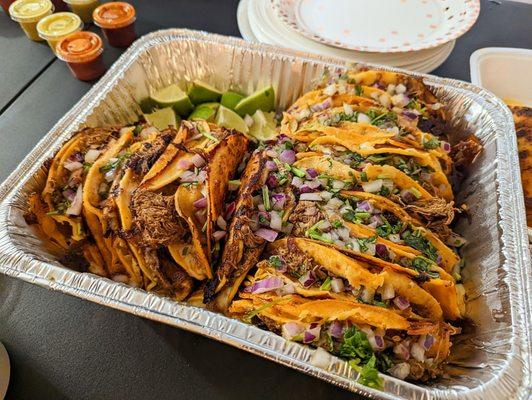 Tray of queso birria tacos