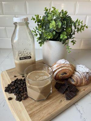 Our Dibs On Nibs spiced cold brew (coffee brewed with cocoa nibs and orange peel) pairs beautifully with our Pain Au Chocolat baking class.