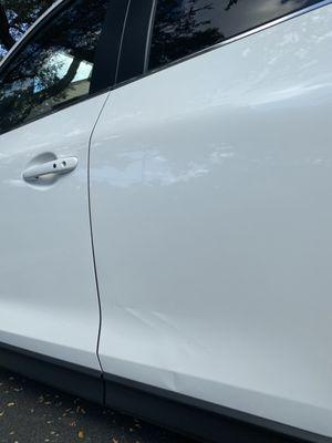 The dent that my sales agent acted like he could not see.