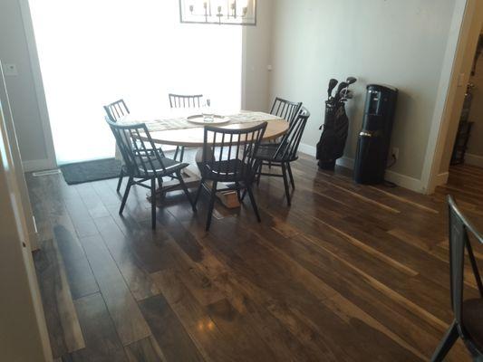 AFTER - Organized and sanitized area. Living room, kitchen and dining area.