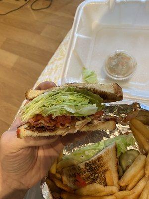 Blt lacking bacon and an entire head of dirty lettuce ontop