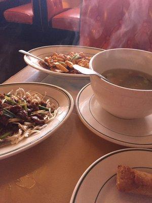 Dinner for two. Garlic chicken, Mongolian beef, sizzling rice soup and egg rolls.