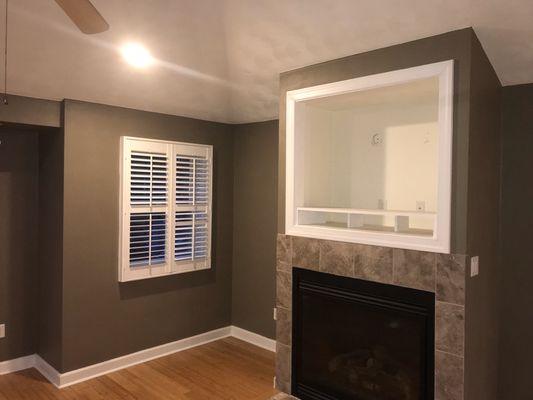 Closer look at the decorative fireplace with TV placement area.