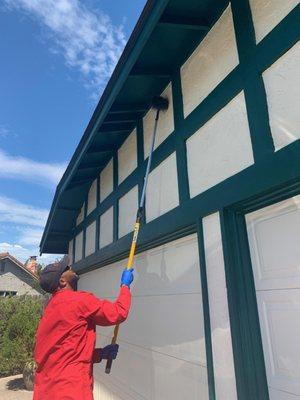 Donald can be seen here sweeping spider webs from a customers home, dewebbing is included in all of our General Pest Services.