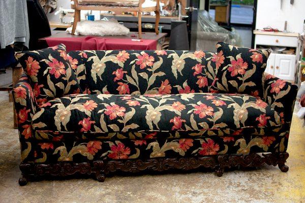 Beautiful antique sofa reupolstered in a soft, gorgeous embroidered floral fabric.