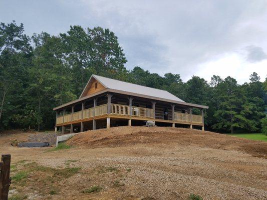 Log Home with wraparound porch.