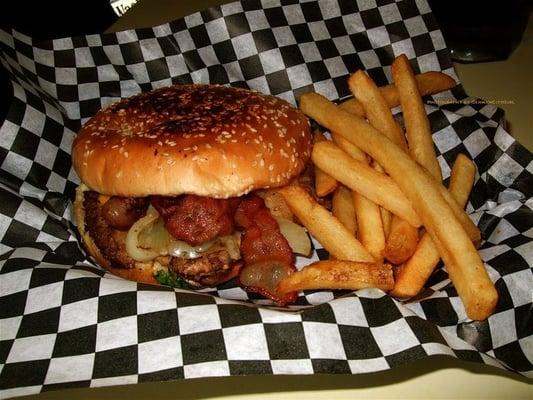 Low Rider burger with bacon, grilled onions, and XXX dressing.