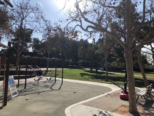 Two big kid swings (no toddler swings), basketball court