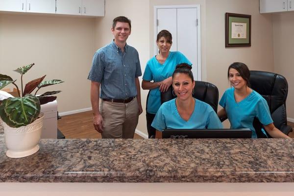 Dr. Bell, Lisa, Cat, and Jessica, our dental family.