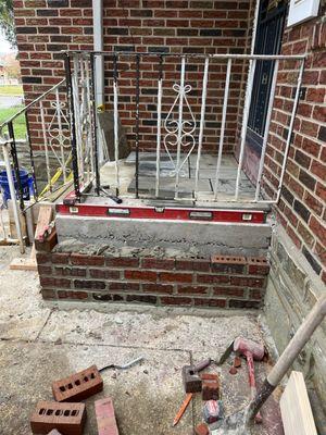 Porch and steps with decorative brick and stone