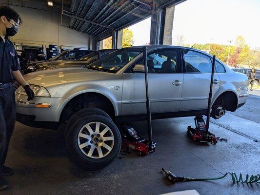 Car wheels and tires removed.