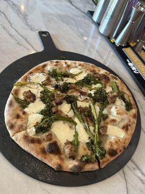 Fresh pizza at Pizza Pie called the CASERTANA.  Fresh mozzarella, Italian Sausage & Fresh broccoli-Rapini.  Homemade dough.