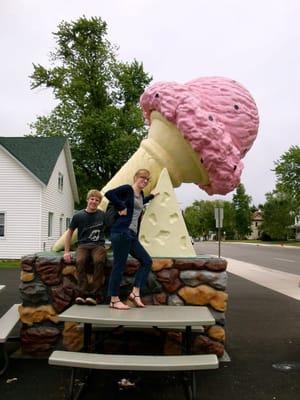 Pink ice cream cone in their parking lot.  They obviously love ice cream!