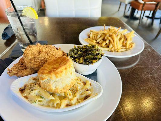 Fried chicken, Mac & cheese, collard greens, with a side of French fries.