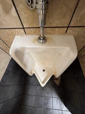 Even the top of the urinal is dirty, clean the damn urinal!!!