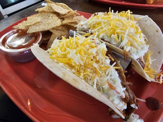 The Taco Tuesday BBQ Pork tacos, topped with coleslaw and a generous helping of shredded cheese. Delicious!