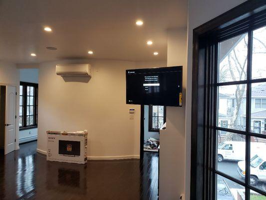 Full motion TV above Fire place huge bedroom