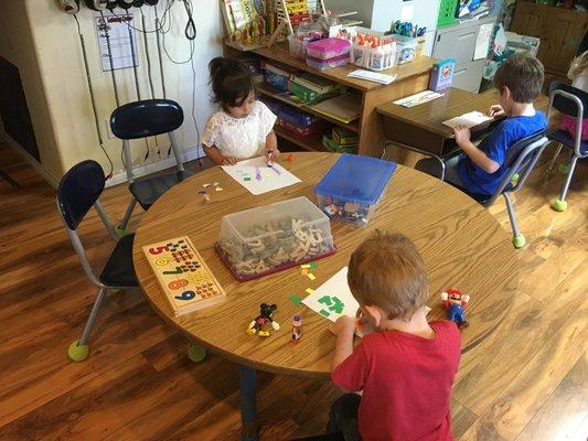 Learning to cut glue and make number art!