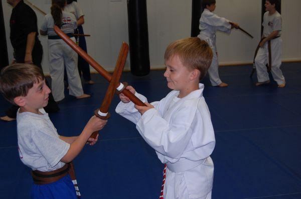 Dylan is focusing very hard on his sword technique.