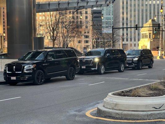 Unleash elegance in downtown Chicago with our sleek black SUVs. Experience luxury and sophistication. Elevate your journey today