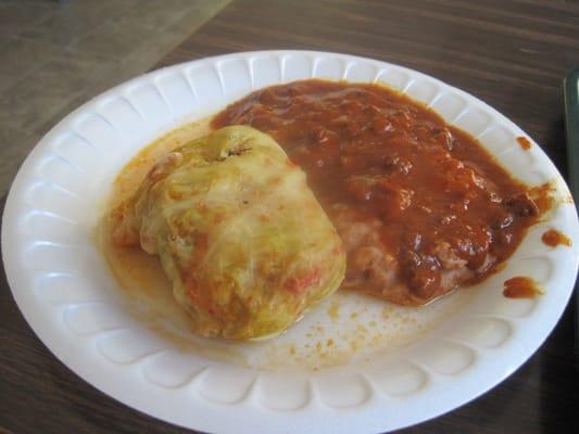 cabbage roll with refried beans topped with chili