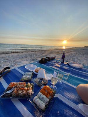 Got sushi to go for a beach picnic!