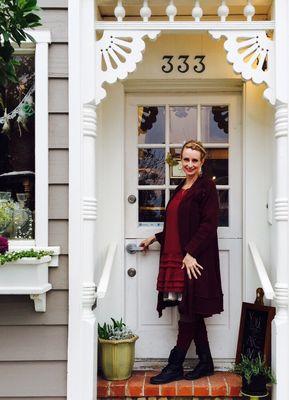 Michelle standing in front of 333 Kasten Street home of "Queen Bee"