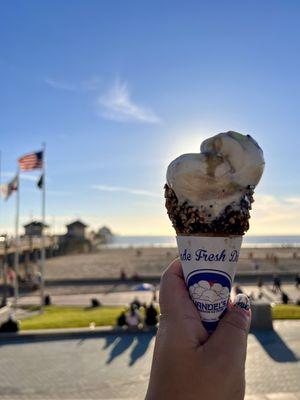 Peppermint chip ice cream in a chocolate peanut cone