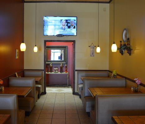 Part of the dining area leading to the rest rooms