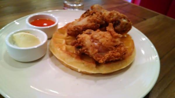 Undercooked, bland "fried" chicken was awful and full of bloodlines (with an above/avg waffle)