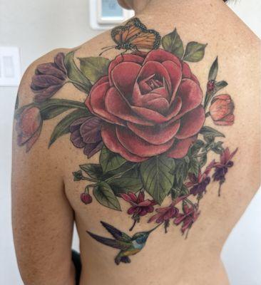 Piece complete! - addition of greenery, fuschias, tulips, hummingbird, and ladybug 12/2024