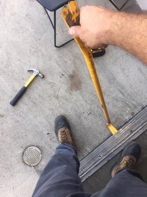 Replacing trash holder on commercial property .