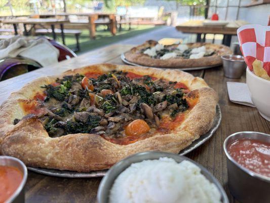 Veggie Pizza (side of ricotta) in the foreground; Cacio e Pepe in the back