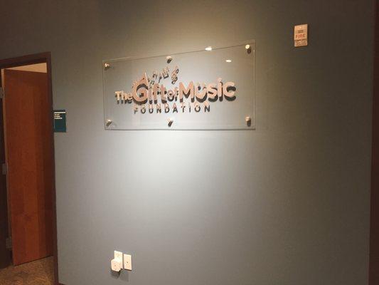 Lobby Sign with Brushed Aluminum Dimensional Letters on Acrylic Panel with Standoffs