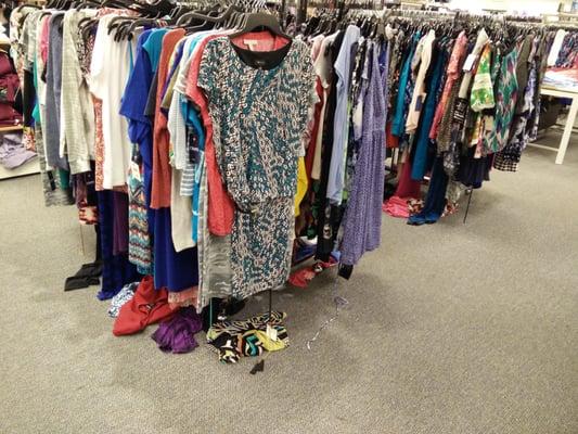 Clothes from racks on floor