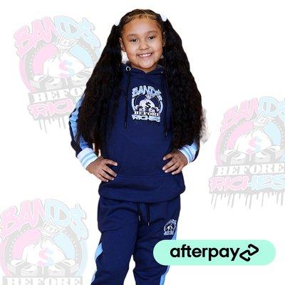 Young girl pictured in a navy bands before riches jogger set for youth.