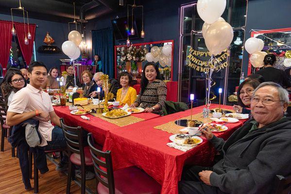 December 30, 2023 - Family enjoying dinner around the table.