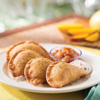 Beef Empanadas -seasoned beef and potatoes, seasoned sour cream and pineapple chutney for dipping.