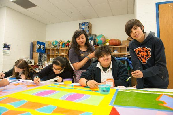 Students learn about textile art during an in-school Residency with an Urban Gateways Teaching Artist.