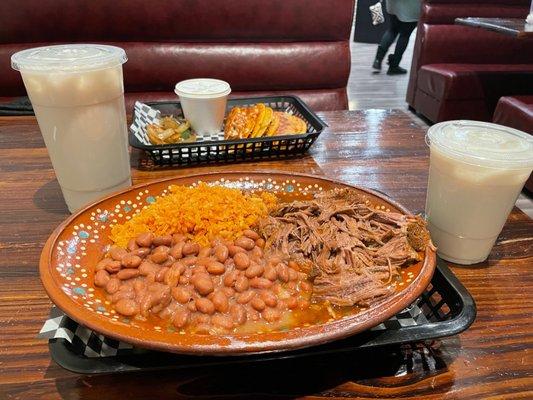 Plato de Birria, Tacos Dorados con Queso with Consome con Carne, and two Horchata