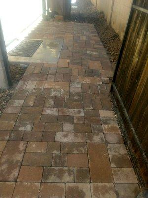 Pavers along side of the house to facilitate bring the trash bins in and out.